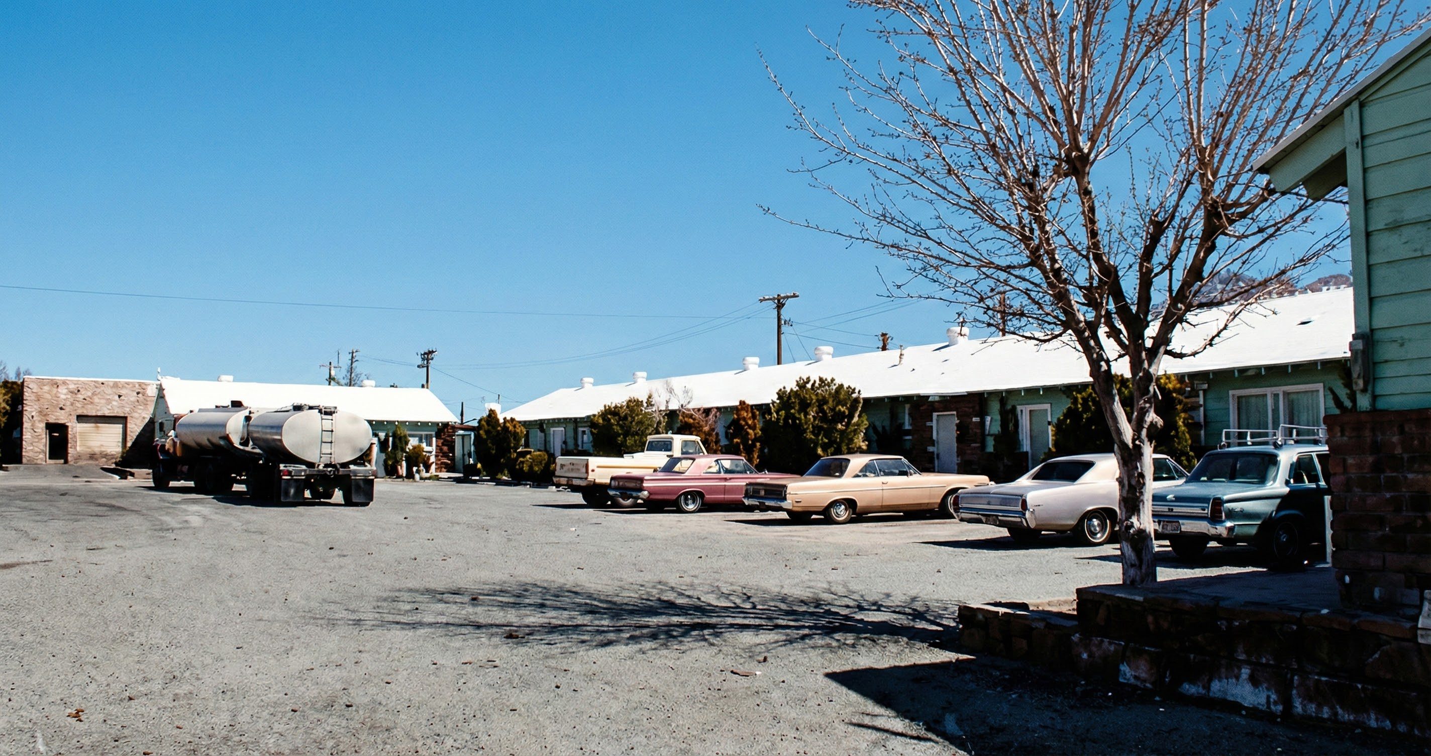 Pop's Oasis motel units with vintage cars